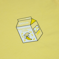 Close-up of Bandan the Banana Dolphin in the banana milk carton chest print on the Bandan Banana Dolphin Milk Tee