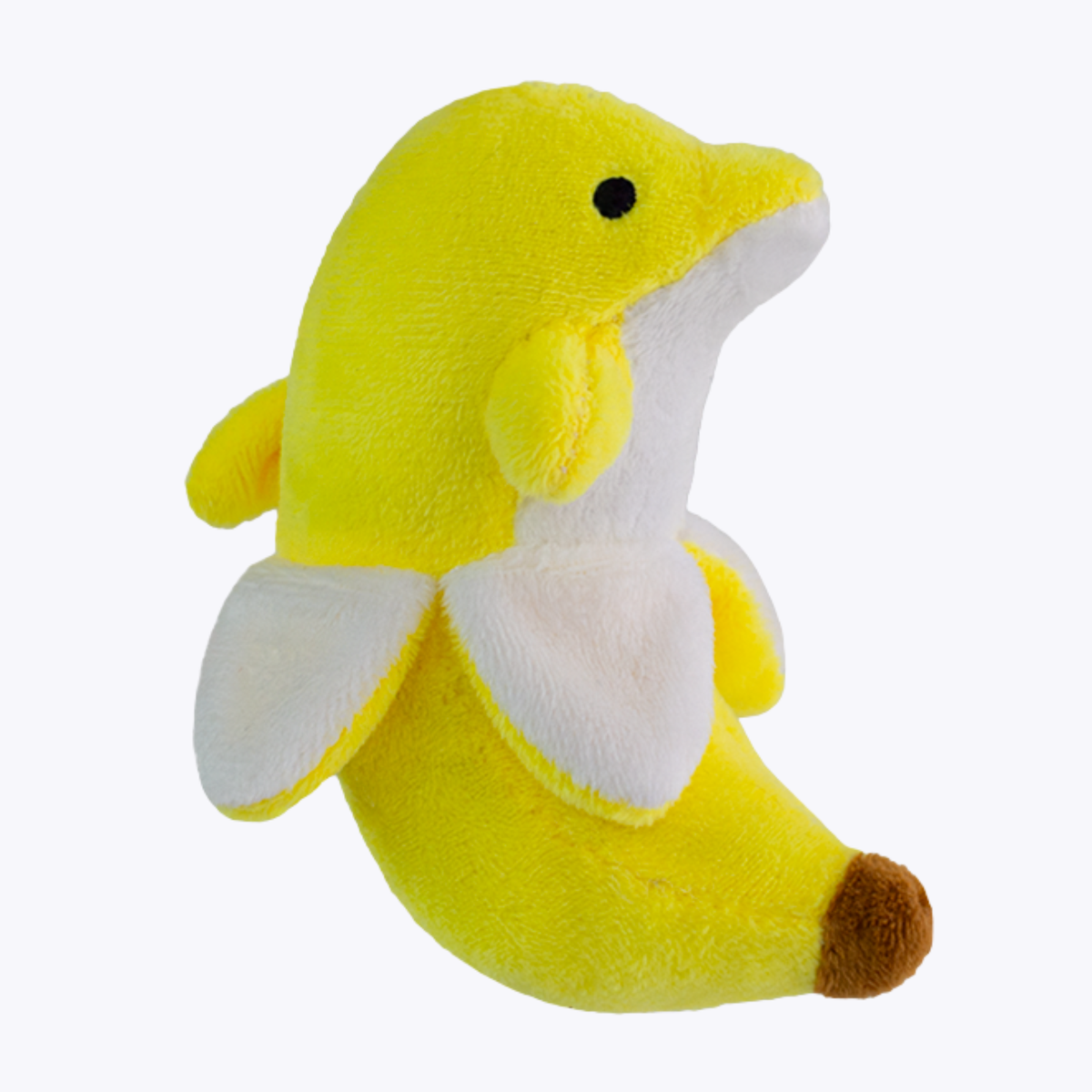 BanDan the Banana Dolphin Miniature Plush, photographed at a three-quarter angle against a light grey studio background