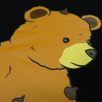Close-up of Chip the Cookie Bear's face on the Onyx crewneck back print