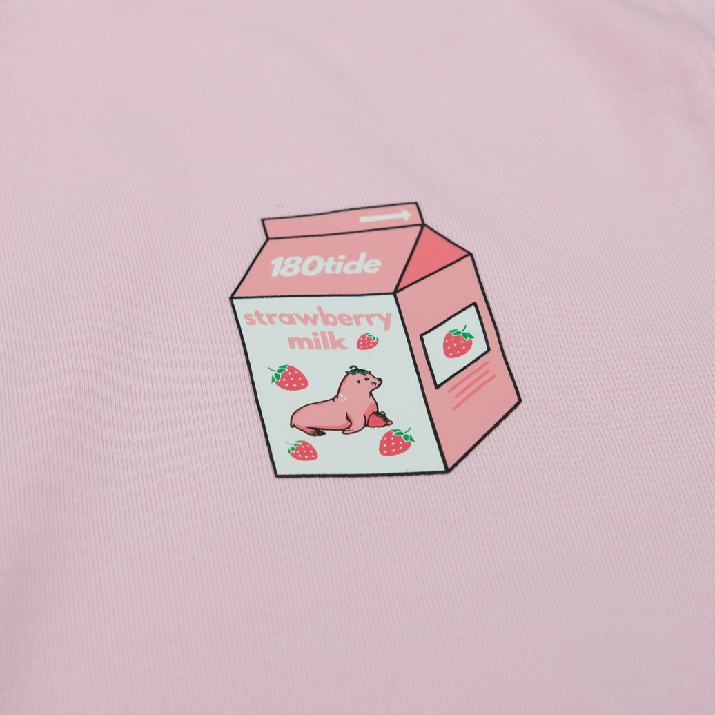 Close-up of Kelsa the Strawberry Seal in the strawberry milk carton chest print on the Kelsa Strawberry Seal Milk Crewneck