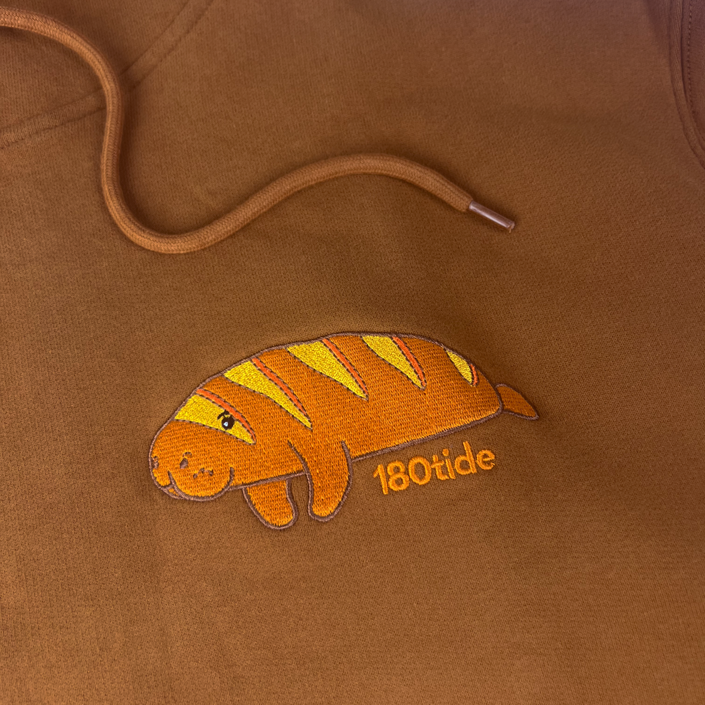 Louis the Baguette Manatee Hoodie – Copper Brown, embroidery close-up