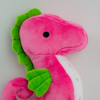 Sol the Dragonfruit Seahorse Plush, face close-up