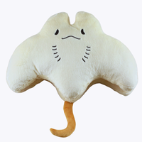 Stacks the Pancake Manta Ray Plush, photographed upside-down against a light grey studio background