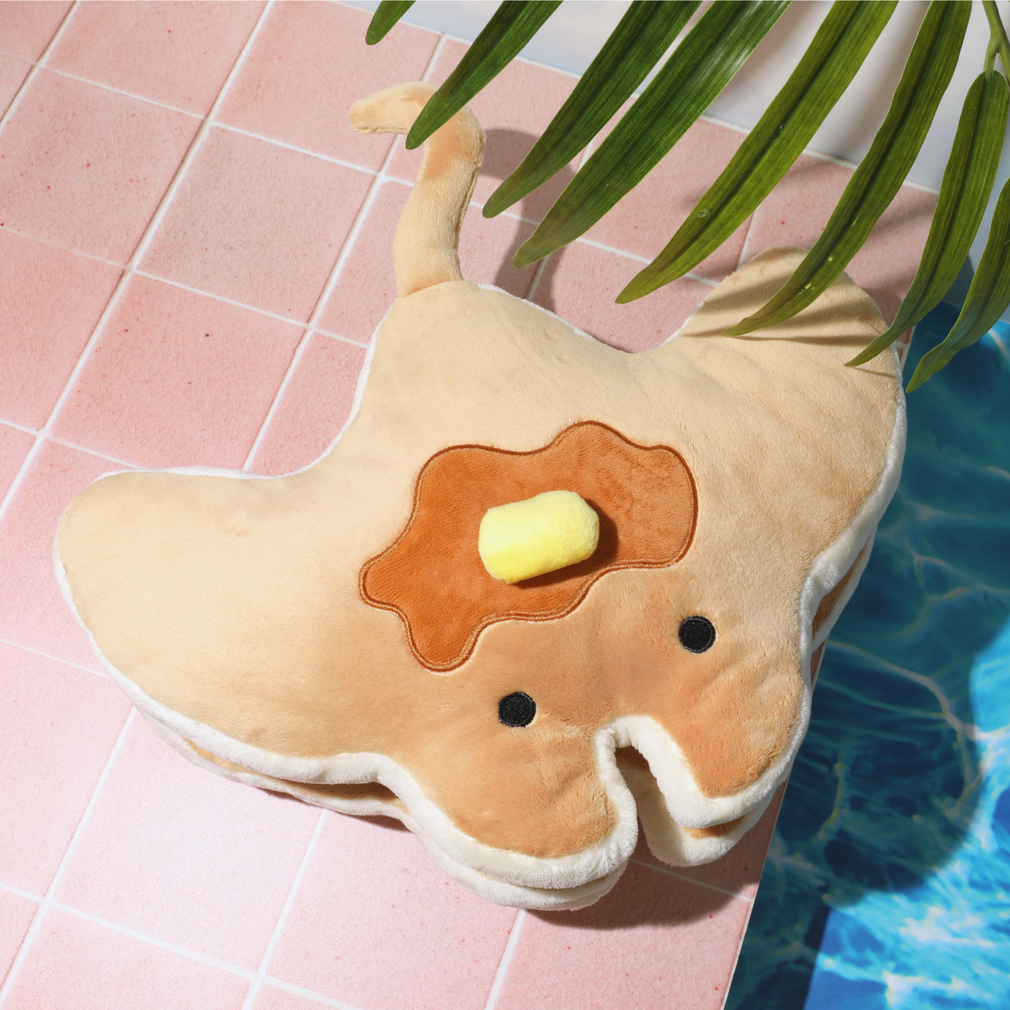 Stacks the Pancake Manta Ray Plush, shown in a lifestyle photo