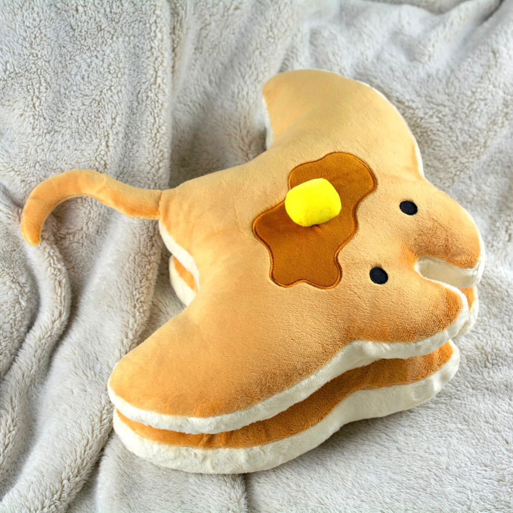 Stacks the Pancake Manta Ray Plush, on blanket